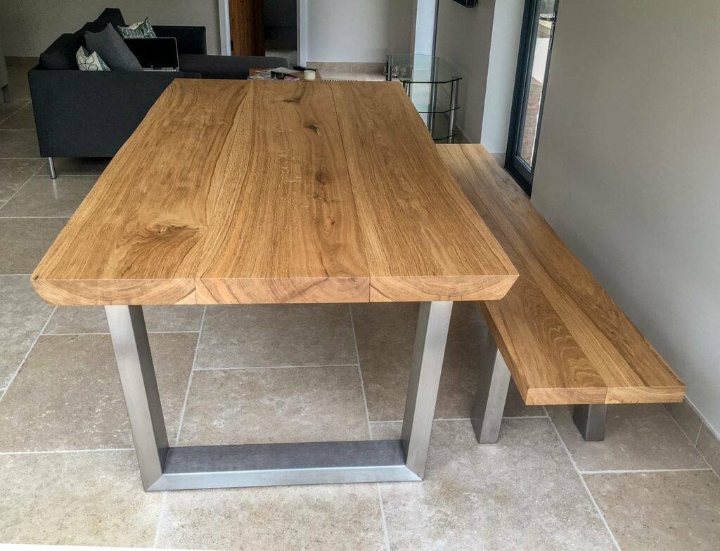 The photos of this Komodo table and bench show French Oak at its very best, exhibiting the beautiful natural colour and grain against a background of muted tones that really make the table top stand out, almost like the room is the frame around the table. A really nice example of how stunning these big thick slabs of natural timber can look.
